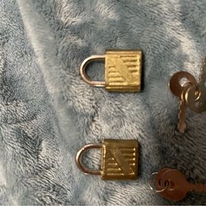 2 small vintage lock and key sets